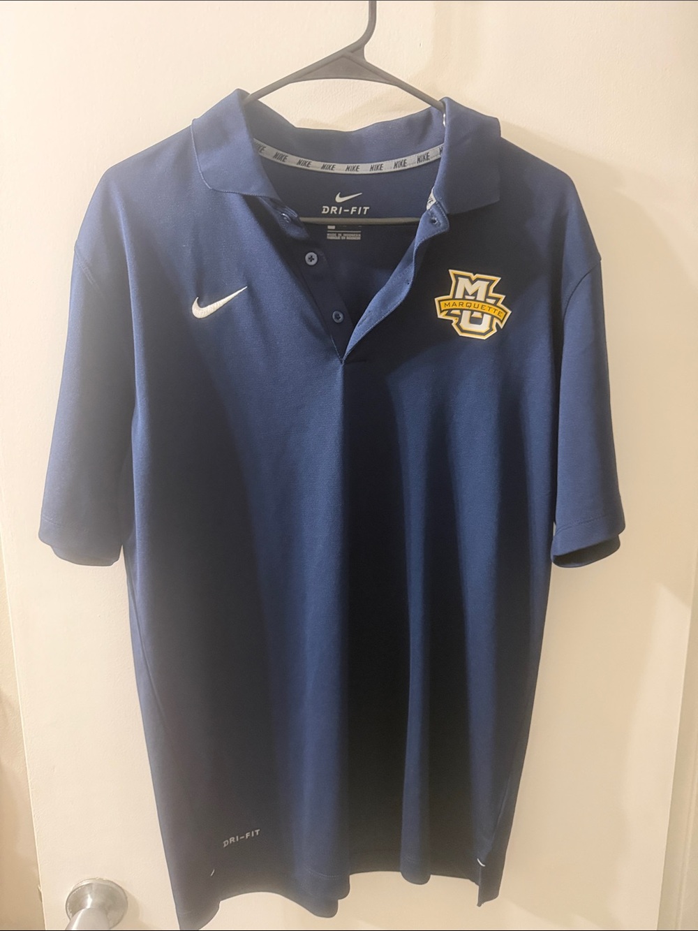 Nike Navy Polo with White Swoosh and Gold Logo